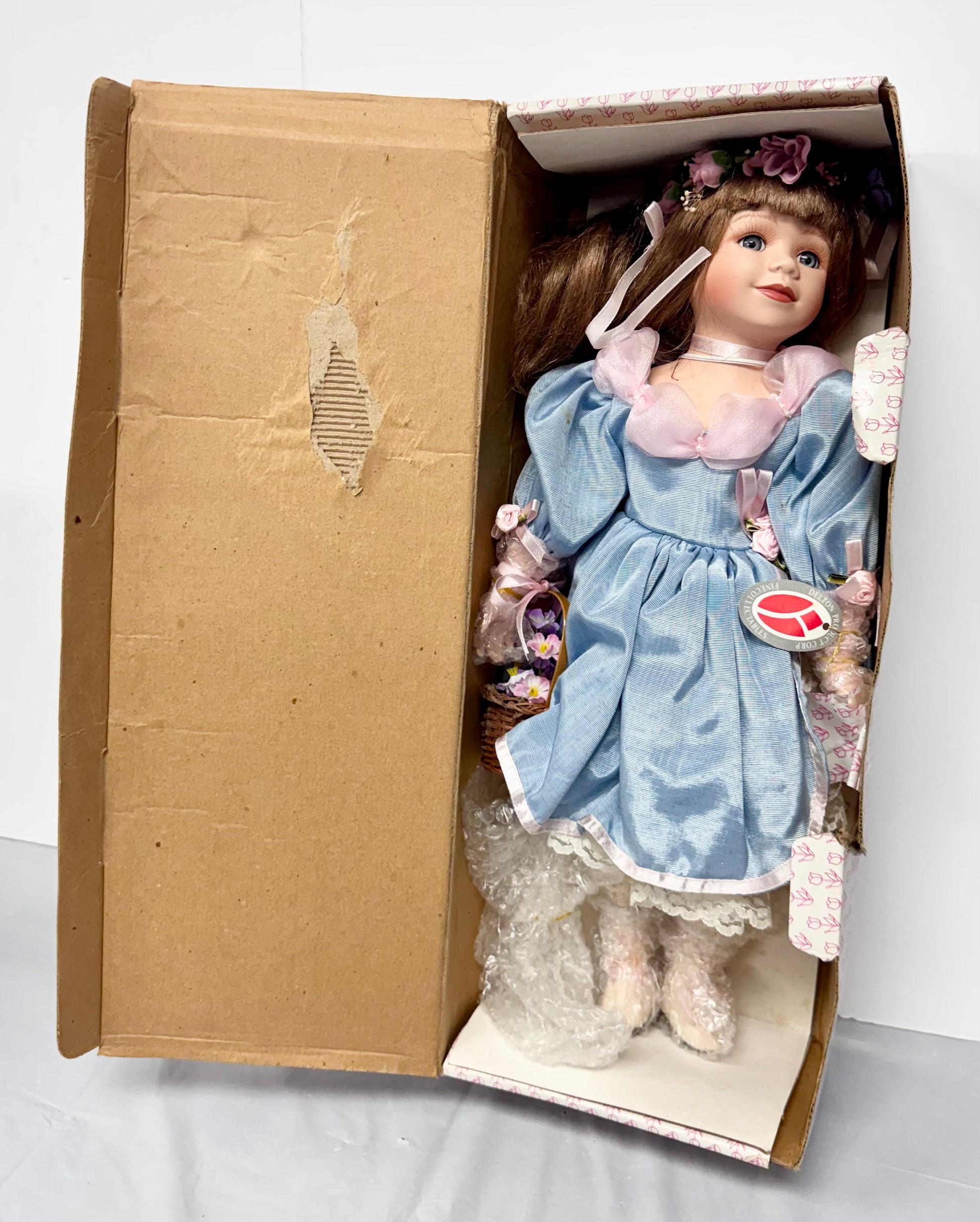 Vintage Porcelain Girl Doll – Auburn Hair, Blue Dress & Flower Basket
